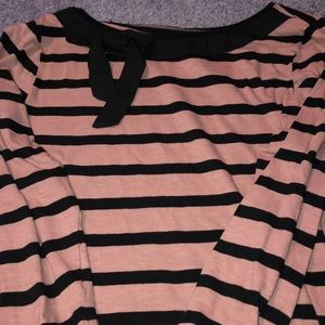 A pink and blacked striped shirt